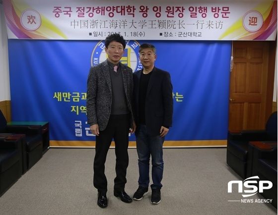 王颖院长（右）与罗义均校长（左）